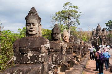 Fototapeta premium Angkor Wat, Cambodia 24 January 2018 : Tourists at Angkor Wat in Siem Reap. Angkor Wat is a 12th century temple and a world famous UNESCO World Heritage site.