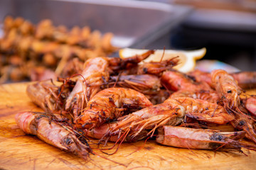 Delicious grilled seafood mussels and shrimp on market
