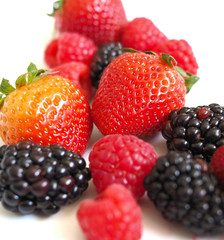 Fresh strawberry, raspberry and blackberry on wooden background, healthy food and diet.