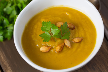pumpkin soup on wooden surface