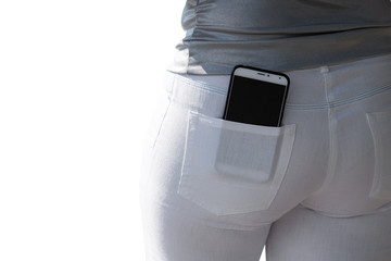 The phone is in the pocket of the girl's white trousers.