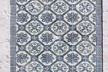 background image of old colorful Portuguese tiles Azulejos, historical patterns, covering the old house in Portugal