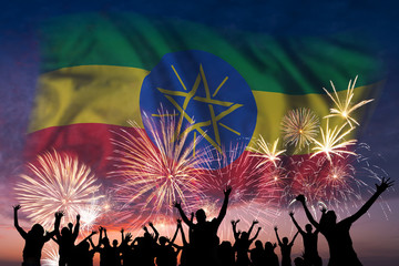 People are looking on fireworks and flag of Ethiopia