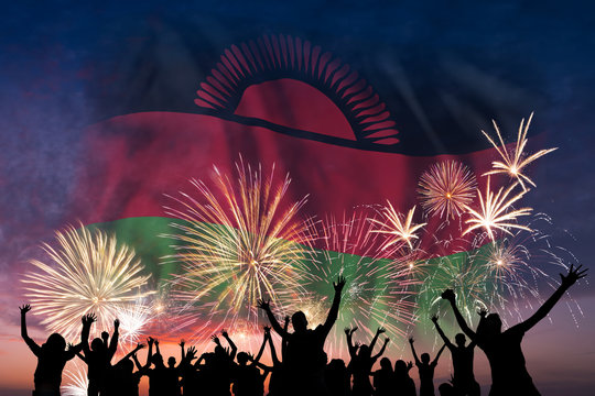 People are looking on fireworks and flag of Malawi - Powered by Adobe