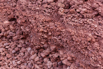 image background texture of the fine fraction of the red stone of basaltic rocks of volcanic origin
