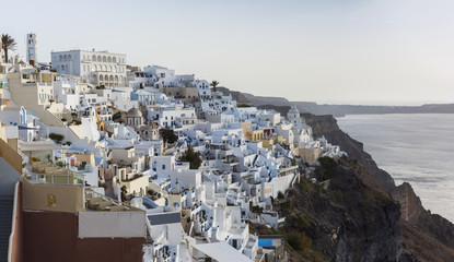 panorama of Santorini, walk along the Caldera of a volcano through small villages, from Oia to Fira, through Imerovigli. many small snow-white houses on the slopes of the island