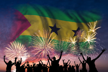 People are looking on fireworks and flag of Sao Tome and Principe