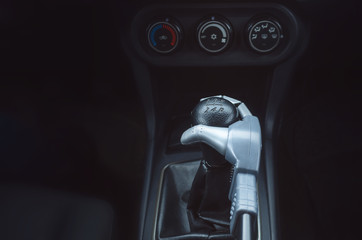 Robot hand on car gearstick. Robot pilot is driving a car. Automatic driver concept.