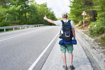 Tourist traveler is on roadside