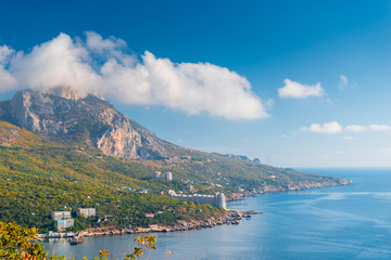 Mountain, covered with clouds against the blue seaThe picturesque bay of Laspi, Crimea
