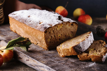 Homemade Apple Cinnamon Coffee Cake with fresh apples on old rustic wooden table. Selective focus