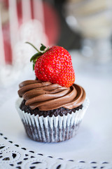 Chocolate cake with strawberries on the table