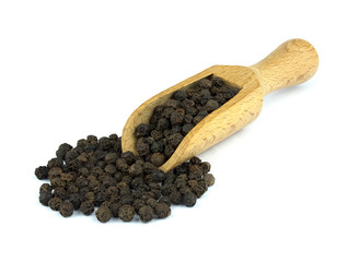 Black pepper on wooden scoop isolated on white background