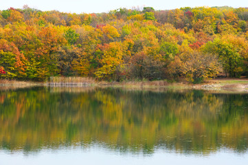 Autumnal landscape with lake and hills