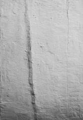 Peeling white paint pattern on old wooden background. Whitewash texture with scratches of the vintage house in the village.