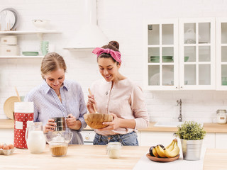 Two cheerful friends cook together. Friends Chef Cook Cooking Concept