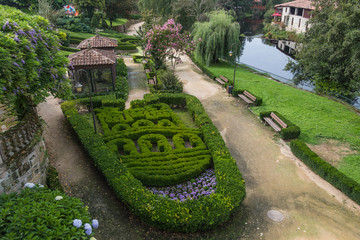 Coat of arms of Allariz in the garden along the river Arnoia, province of Ourense. Galicia. Spain. 