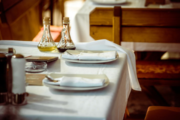 Olive oil and spices on the table in the restaurant 