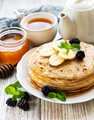 Delicious pancakes with blackberries and bananas