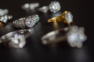 Jewelry diamond rings set on black background close up