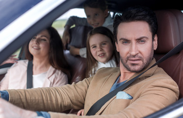 Obraz premium modern family travels by car