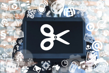 Man offers a laptop with scissors icon on a virtual doodle interface. Edit media content concept. Photo Video Music File Design Development concept.