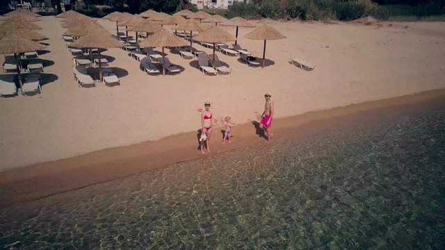 Family on beach aerial shot, Sithonia, Greece