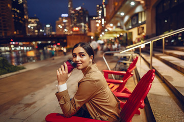 Fototapeta premium woman drinking coffee at night