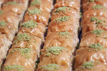 Traditional Turkish dessert baklava with nuts and honey. Close-up