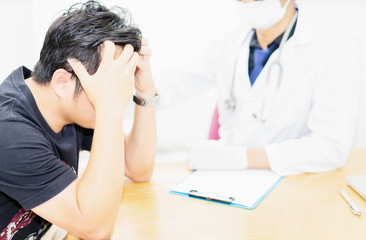 The doctor and the patient are discussing the treatment of the disease.The doctor is treating the...