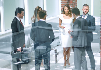 group of business people standing in the Bank hall