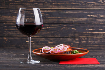 Juicy steak with onions, lettuce and parsley