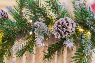 Christmas and New Year holidays background.  Christmas tree decorated with cones and balls. Celebration concept