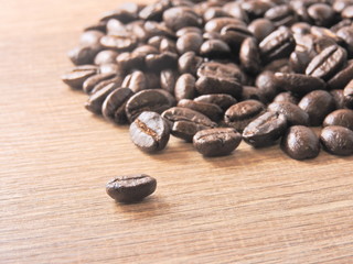 A pile of roasted coffee beans background.It  can be made into drinks and beverages,like latte,cappuccino, espresso.Economic crop in global trade business,agricultural products exports.