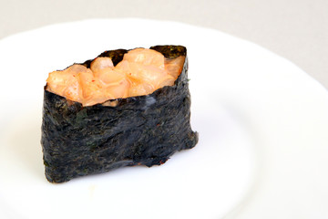Spice sushi with smoked salmon. In nori seaweed.