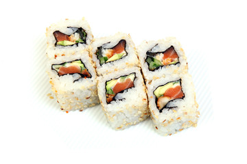 Roll California in sesame. Sushi with crab, eel, cucumber. Japanese food on a beautiful dish.