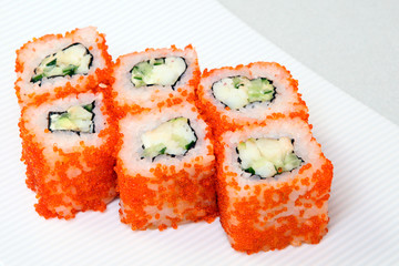 Sushi. Rolls with shrimp. Roll California with avocado. Japanese food. Healthy food is nicely laid out on a platter.