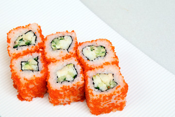 Sushi. Rolls with shrimp. Roll California with avocado. Japanese food. Healthy food is nicely laid out on a platter.