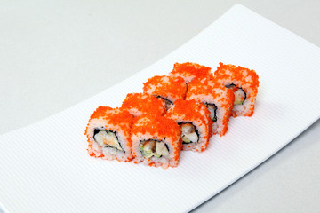 Sushi. Rolls with shrimp. Roll California with avocado. Japanese food. Healthy food is nicely laid out on a platter.