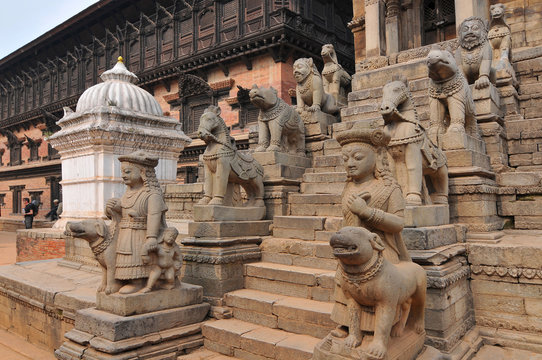 Statues at the staircase of the Siddhi Lakshmi Shikara temple in the Durbar Square, Nepal.