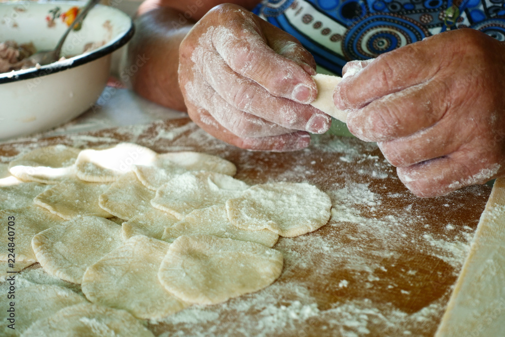 Wall mural home-made recipe for dumplings (raviol)i. traditionally, women of the older generation mold the dump