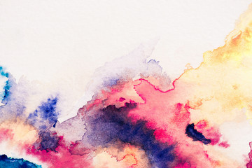 abstract painting with red, yellow and blue watercolor paints on white background