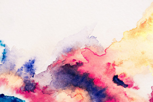 abstract painting with red, yellow and blue watercolor paints on white background