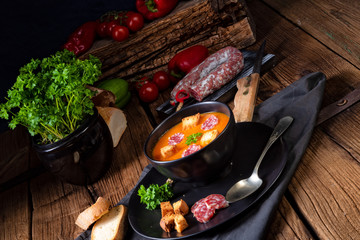 Hungarian paprika cream soup with spicy sausage