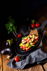 Eggplant grilled with aromatic feta cheese and tomatoes