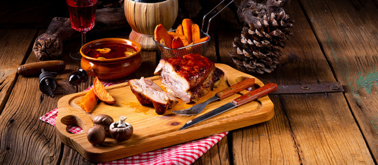 spicy roasted meat with mushroom sauce in the oven