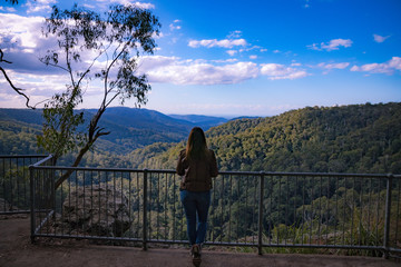 Fototapeta na wymiar Female observing Australian forest from high