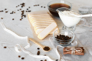 Cooking Tiramisu concept step by step. Homemade tiramisu cake. Ingredients for making perfect Italian dessert