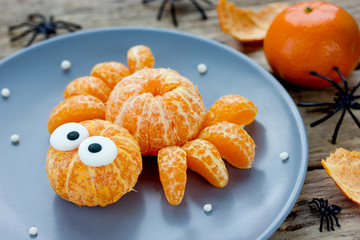 Fruit spider snack for kids made from fresh  tangerine