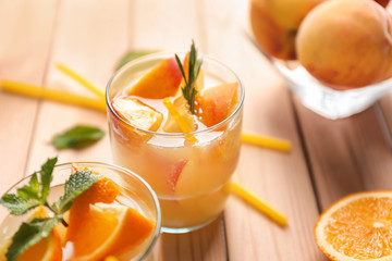 Fresh summer cocktail in glasses on wooden table